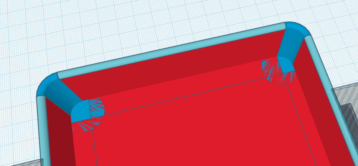 a view into the tray showing where the corners meet the overlapping floor rectangles.