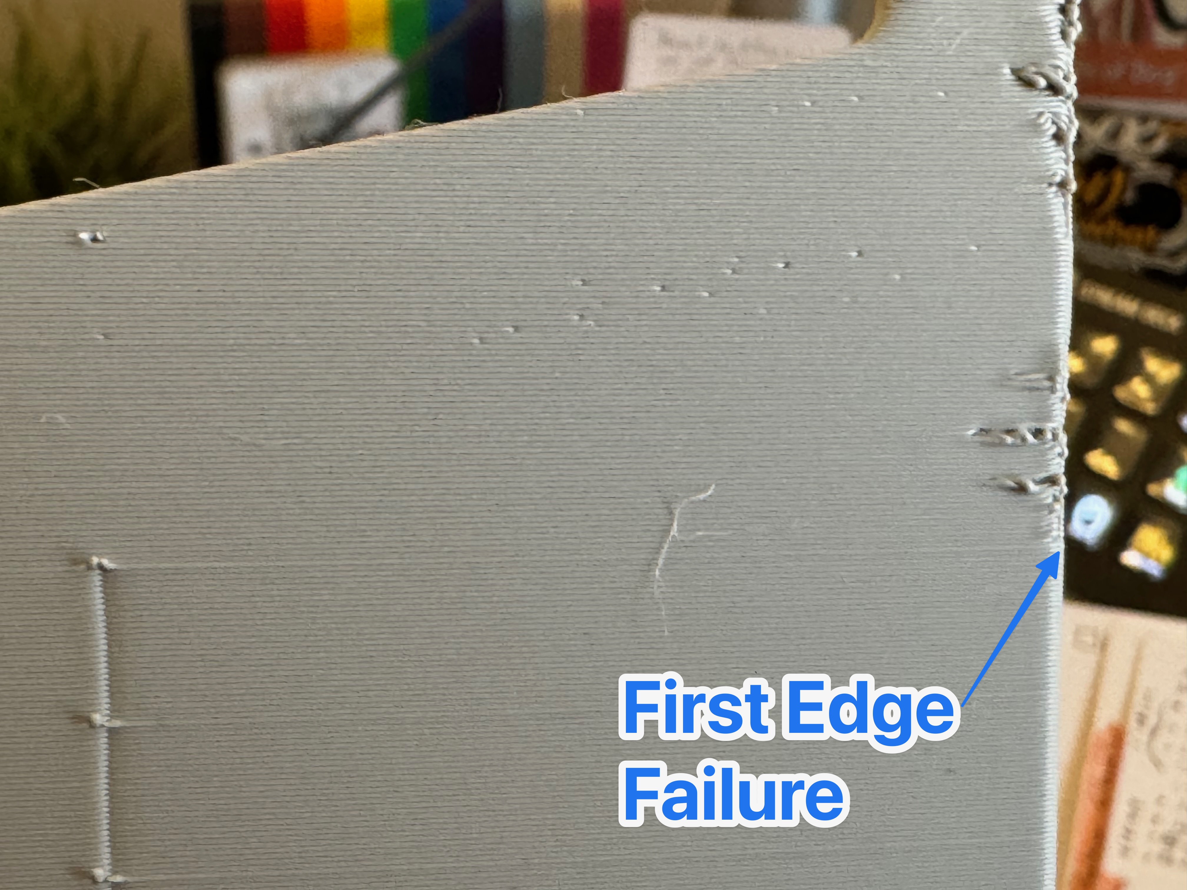 an annotated image of the underside of the print showing where the seam stopped, and the failure started to appear.